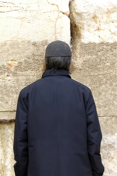 Jewish worshiper prays at the Wailing Wall an important jewish religious site at winter in Jerusalem, Israel