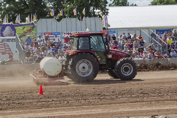 Case Tractor watering the track