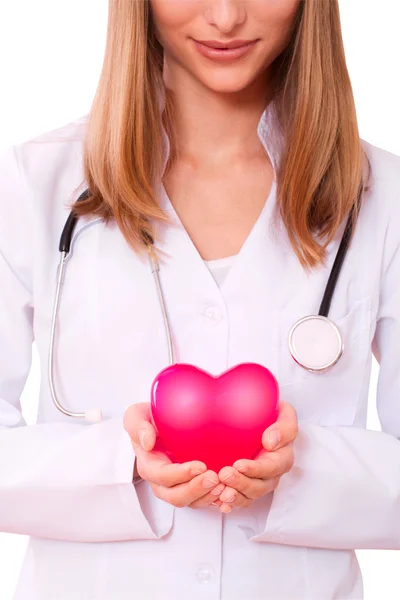 Female doctor holding a heart.