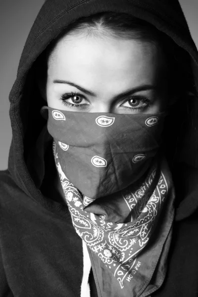 Girl hood and scarf covered face
