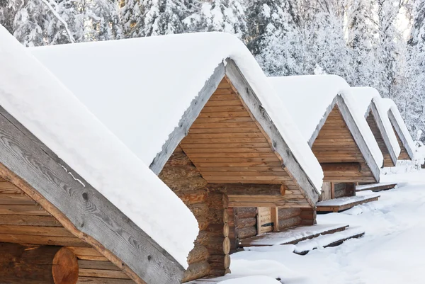 Small camping houses at snowy winter day