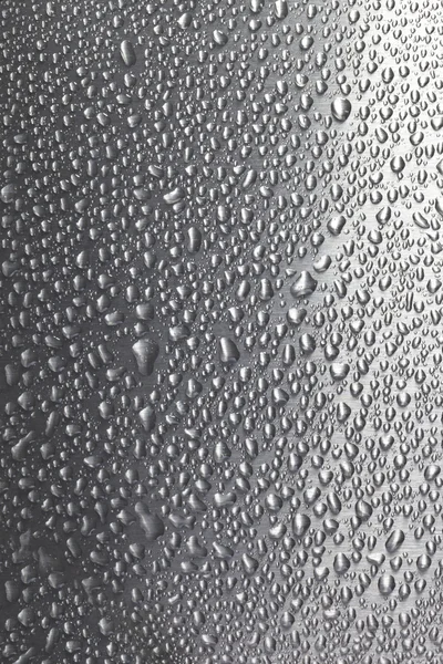 Water droplets on brushed metal