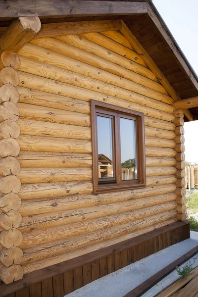 House. Wooden frame. Window in the wall wooden frame