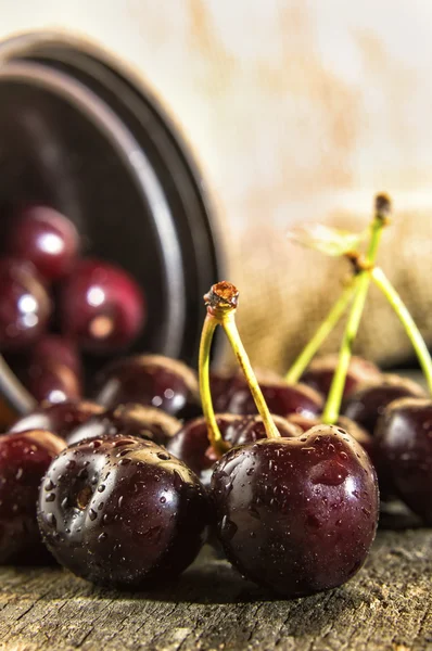 Cherries on wooden table.