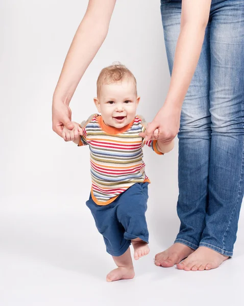 Baby taking first steps