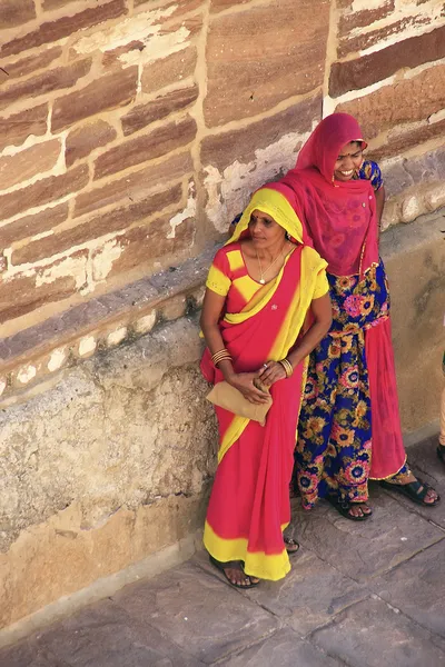 Indian women standing by the wall, Mehrangarh Fort, Jodhpur, Ind