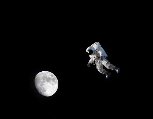 Astronaut with moon — Stock Photo #21654149