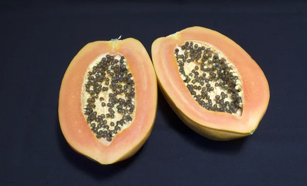 A papaya fruit cut in half