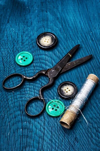 Buttons and sewing tool
