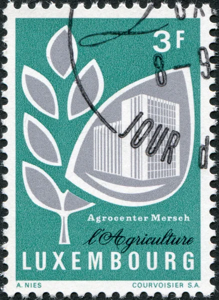 LUXEMBOURG - CIRCA 1969: A stamp printed in Luxembourg, shows Grain and Mersch Agricultural Center, circa 1969