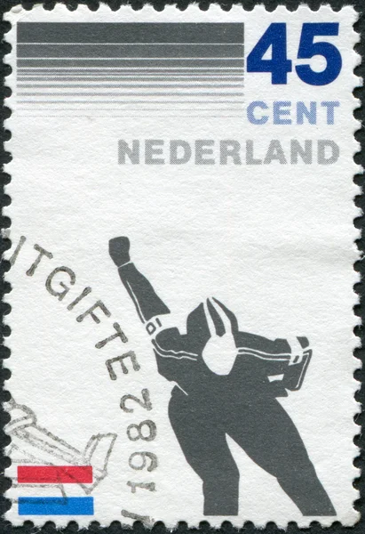 NETHERLANDS - CIRCA 1982: A stamp printed in the Netherlands, is dedicated to the 100th anniversary of Royal Dutch Skating Federation, shows a skater, circa 1982
