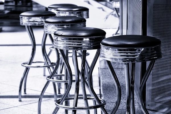Bar stools. Black and white. Toning.