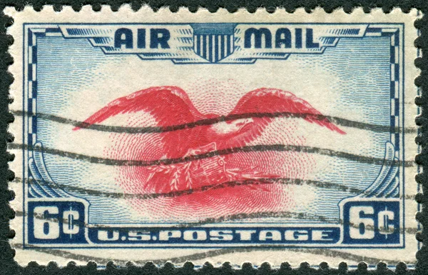 Postage stamps printed in USA, shows Eagle Holding Shield, Olive Branch and Arrows