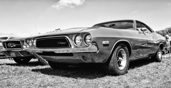 PAAREN IM GLIEN, GERMANY - MAY 19: Pony car Dodge Challenger, black and white, The oldtimer show in MAFZ, May 19, 2013 in Paaren im Glien, Germany