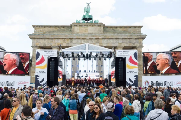 Citizens and guests of the city near the Brandenburg Gate. The Day of German Unity is the national day of Germany