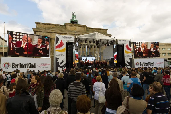 Citizens and guests of the city near the Brandenburg Gate. The Day of German Unity is the national day of Germany