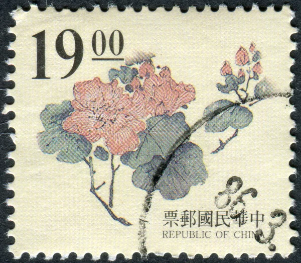 Postage stamp printed in Taiwan shows, wood carving Ming dynasty, peony flower