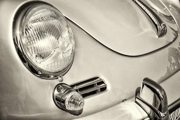Detail of the front of the sports car Porsche 356, black and white