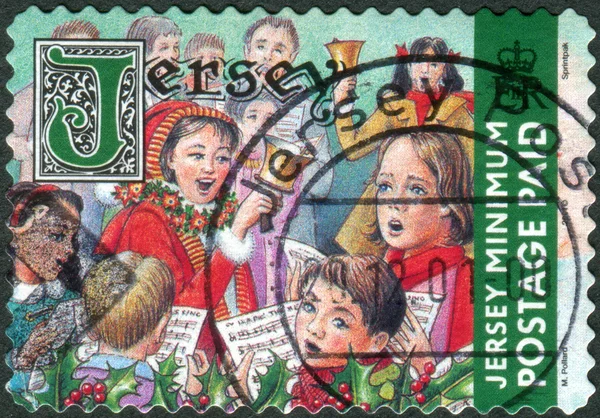 Postage stamp printed in Jersey (Crown dependencies of the British Crown), Christmas Issue, shows children sing Christmas songs