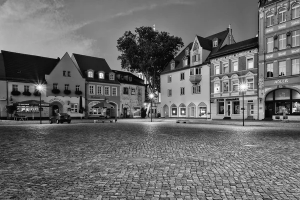 Market Square. The ancient city of Senftenberg. First mentioned in chronicles in 1276. Black and white. Styling. Large grains