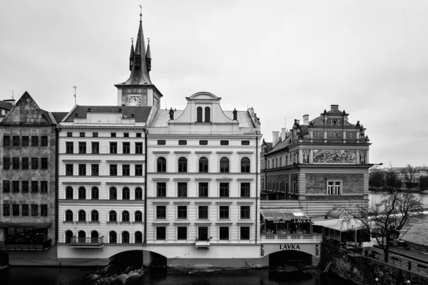 House of old Prague and Vltava river. Black and White. Stylized film. Large grains.