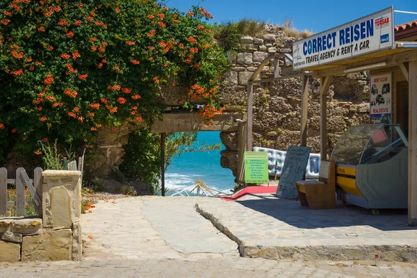 Passage to the sea through the ancient wall. Anatolian coast - a popular holiday destination in summer of European citizens.