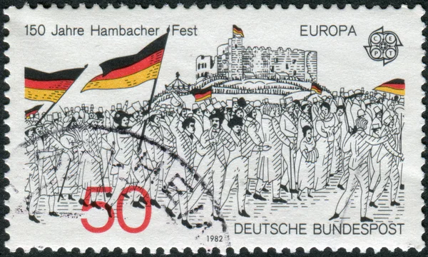 Postage stamp printed in Germany dedicated to the 150th anniversary of the Hambach Festival, shows a Procession to Hambach Castle