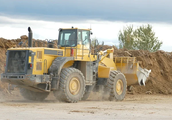 Heavy front loader in open pit