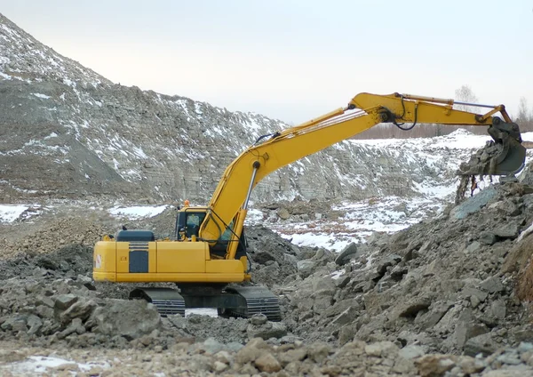 Digger in open pit