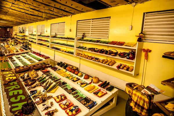 Farmers market shelves with fruit and vegetables