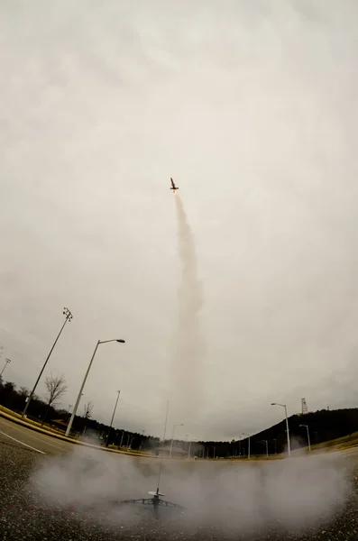 Model rocket launch in parking lot — Stock Photo #40666605