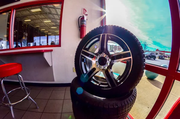 Car tires on display for sale at a tire shop store