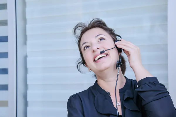 Happy support phone operator in headset