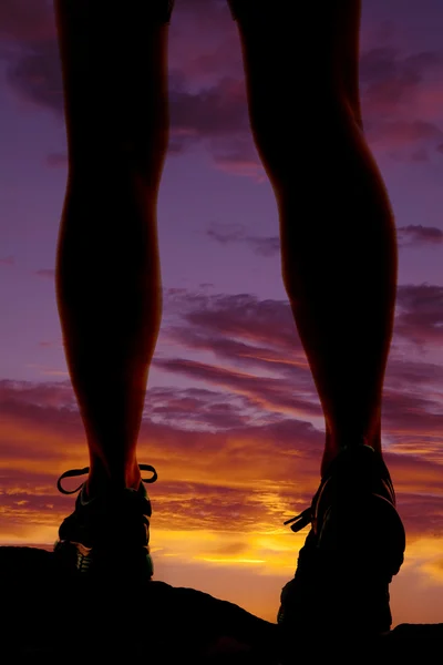 Woman legs walk sunset