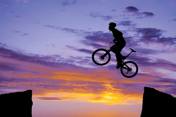 Man on bike jumping silhouette — Stock Photo #29188099