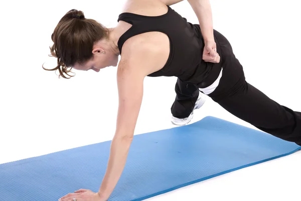 Woman doing a one armed push up