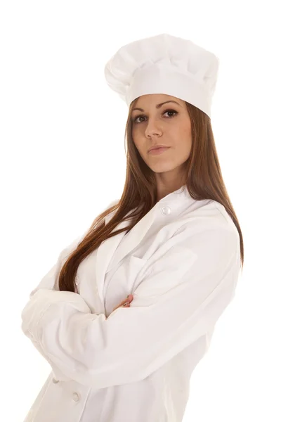Woman baker arms folded side serious