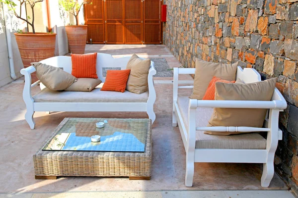 Beautiful mediterranean patio with white outdoor furniture