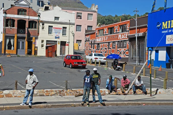 Men wait the any job on street in Cape Town, South Africa