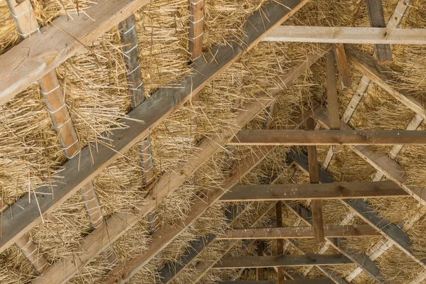 The construction wooden roof from straw, Maurzyce, Poland