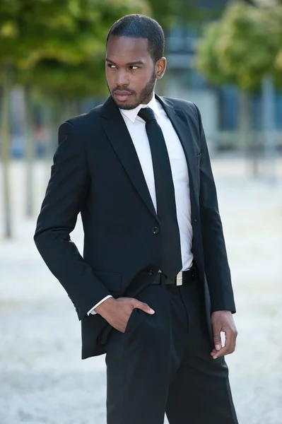 Young African Male in a Suit Outside