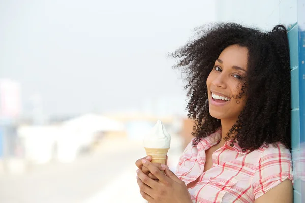 Smiling young woman with ice cream