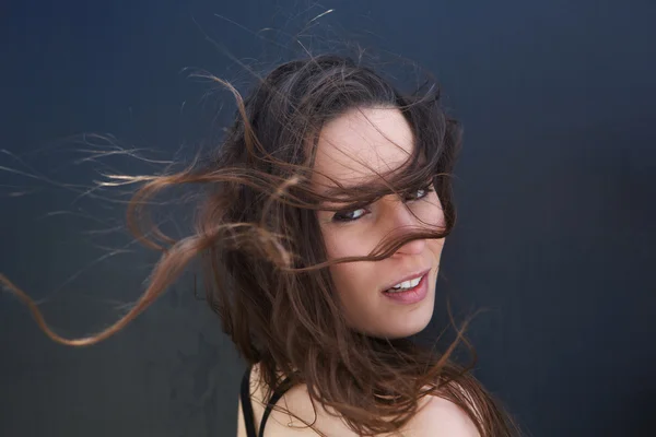 Female fashion model with hair blowing