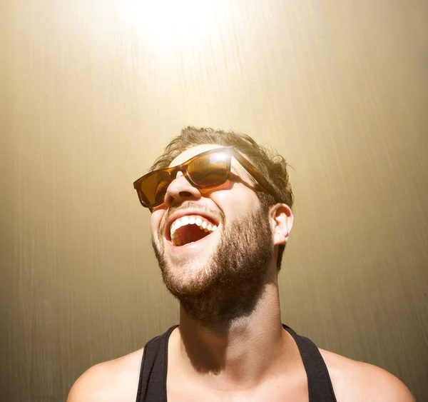 Happy young man smiling with sunglasses