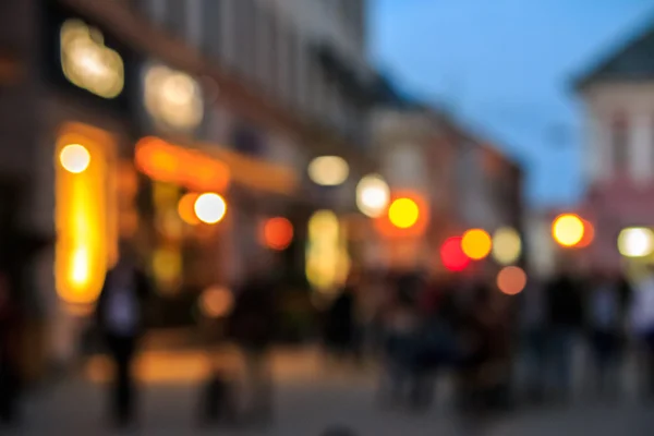 Crowd  moving on old city night street blurred