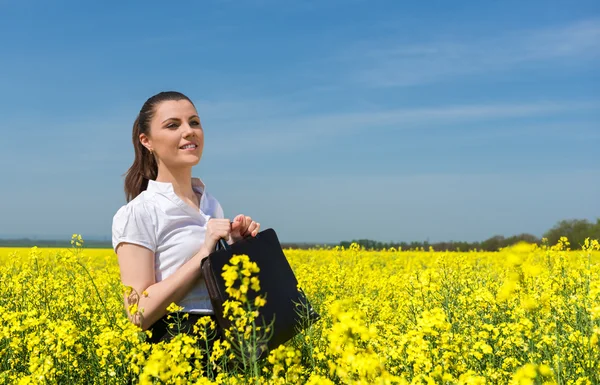 Business woman at the flower field