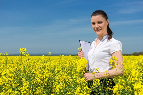 Business woman at the flower field