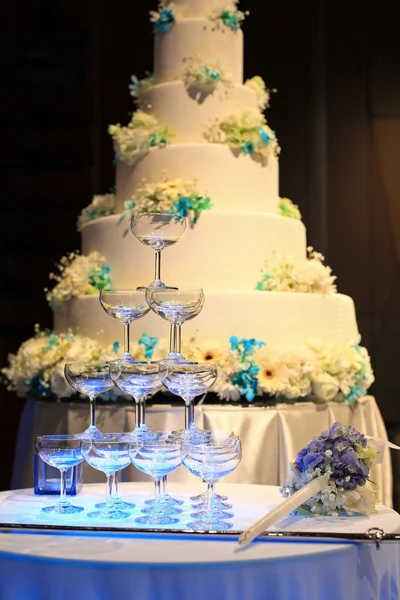 Champagne glasses and wedding cake