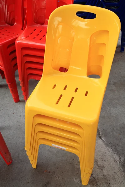 Yellow and red plastic chairs