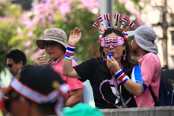 Thai protestors blowing whistle to anti Yingluck government